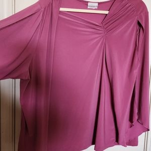 This is a dressy shirt that has cutouts in the arms.